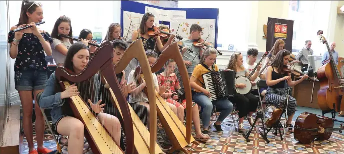  ??  ?? Young musicians giving a lunchtime concert in The Tholsel