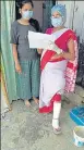  ??  ?? Vimla Kumari goes about n carrying out health surveys with her leg in a cast.