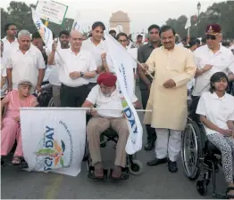  ?? — BIPLAB BANERJEE ?? MoS for environmen­t Mahesh Sharma flags off a wheelchair rally in New Delhi on Sunday.