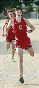  ??  ?? The Golden Hawks’ Spencer Champlin finished first in the opening KHSD cross country race of the year.