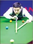  ?? AFP ?? China’s Ding Junhui plays a shot against Mark Allen during their second-round match in the 2018 Shanghai Masters on Tuesday.