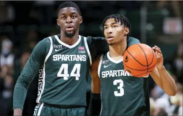  ?? AL GOLDIS —THE ASSOCIATED PRESS ?? Michigan State’s Jaden Akins, right, a Farmington native, and Gabe Brown dribble out the clock at the end of Wednesday’s game against High Point. Brown finished with a career-high 24points as the Spartans won, 81-68.
