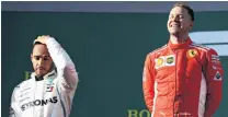  ?? PHOTO: GETTY IMAGES ?? Ecstasy and agony . . . Ferrari’s race winner Sebastian Vettel (right), of Germany, looks ecstatic and Mercedes’ runnerup Lewis Hamilton, Britain, dejected on the podium after the Australian Grand Prix in Melbourne yesterday.