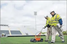  ??  ?? Kevin Miller, left, and Vic McLaughlin paint lines on the field at Fortress Field, a $15 million stadium that is the nation’s first venue with a lacrosse team as the primary tenant.