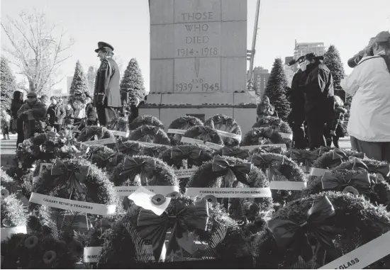  ?? Christina Ryan/Calgary Herald ?? Calgarians laid wreaths at Central Memorial Park on Monday as part of Remembranc­e Day ceremonies. Thousands gathered at services across the city to honour Canada’s troops.