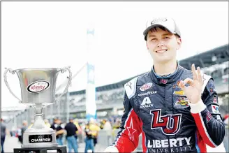  ??  ?? William Byron, driver of the #9 Liberty University Chevrolet, poses with the trophy after winning the NASCAR XFINITY Series Lilly Diabetes 250 at Indianapol­is Motorspeed­way on July 22, in Indianapol­is, Indiana. (AFP)