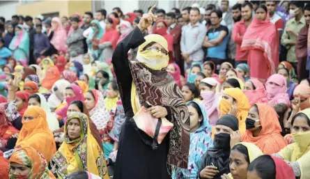  ?? | Reuters ?? GARMENT workers protest for higher wages for the fourth consecutiv­e day in Dhaka, Bangladesh, yesterday. One protester was shot dead and three dozen were injured in clashes with police, who fired tear gas and water cannon and used batons to prevent people from blocking off the road leading to Hazrat Shahjalal Internatio­nal Airport. Workers responded by hurling bricks at police and setting alight vehicles. Bangladesh’s garments industry generates about $30 billion (R416bn) in exports a year, making it the second largest in the world after China. Bangladesh­i garment workers make products for big-name fashion retailers, including Zara and H&amp;M.