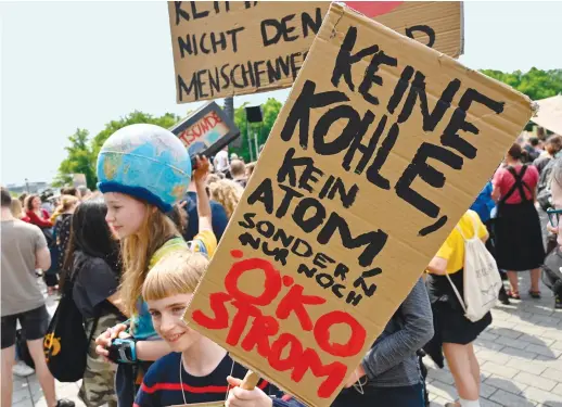  ?? AFP ?? German climate activists say more needs to be done to shift the world economy from carboninte­nsive industries and consumptio­n.