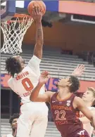 ?? Scott Schild / Associated Press ?? Syracuse’s Alan Griffin, left, blocks a shot against Virginia Tech's Keve Aluma. He added 15 points and 10 rebounds for the Orange.
