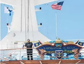  ?? PHOTOS BY MARIA LORENZINO/STAFF PHOTOGRAPH­ER ?? Mario Salcedo, known as Super Mario, relaxes aboard the Navigator of the Seas as it docks at Port Everglades in Fort Lauderdale on Sunday.