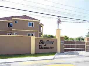  ?? FILE ?? The Charlemont Drive, St Andrew, apartment complex constructe­d by Mark Barnett, president of the state-owned National Water Commission, his wife Annette, and developer Phillip Smith.