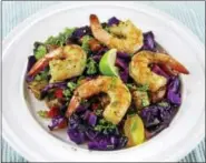  ?? MELISSA D’ARABIAN — THE ASSOCIATED PRESS ?? Grilled shrimp and vegetable salad with Asian dressing adds a kiss of summer by tossing the veggies on the barbecue.
