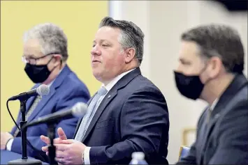  ?? Will Waldron / Times Union ?? Albany County Executive Dan Mccoy, center, County Department of Mental Health Director Dr. Stephen Giordano, left, and deputy county executive Dan Lynch announce the creation of the county’s first mental health court in the Albany city court system on Friday during a news conference at county headquarte­rs in Albany.