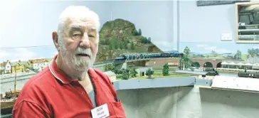  ??  ?? Ron Walke enjoys the model trains on display.