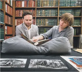  ?? ?? DARK CHAPTER: York Civic Society manager Dr Duncan Marks and York civic archivist Catriona Cannon looking at wartime artefacts and maps.