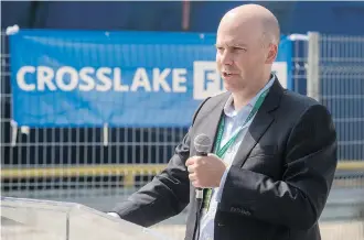  ??  ?? Mike Cunningham, CEO of Toronto-based Crosslake, speaks during a ceremony in August in front of C.S. IT Intrepid. The company was celebratin­g the fibre-optic cable’s landing a few kilometres from the Port of Toronto.