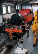  ?? NOEL HARTLEY ?? Tom Kay applies red top coat to Ivatt No. 41241 at Haworth on June 12 as project leader Peter Turner looks on.