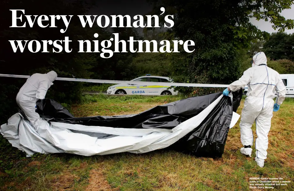  ??  ?? HORROR: Gardai examine the scene in Clondalkin where a woman was sexually attacked last week. Photo: Gerry Mooney