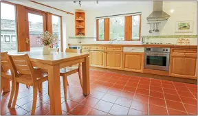  ??  ?? MODERN DIMENSION: Beckside House’s spacious tile-floored kitchen/diner