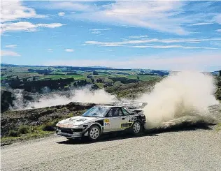  ?? PHOTO: GEOFF RIDDER ?? Eat my dust . . . Mosgiel driver Chris Hey sprays some dust in the Burma Rd hill climb event in South Otago last weekend.