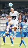  ??  ?? Pumas’ Carlos Gonzalez heads the ball next to Tigres’ Jair Diaz (right), during a Mexico Soccer League game in Mexico City on
Aug 4. (AP)