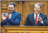  ?? ARVIN TEMKAR/ARVIN. TEMKAR@AJC. COM ?? Lt. Gov. Burt Jones (left) and Gov. Brian Kemp can raise unlimited funds with leadership committees while rivals cannot.