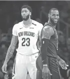  ?? JAE C. HONG/AP ?? LeBron James, right, and Anthony Davis could be teammates in LA sooner rather than later.