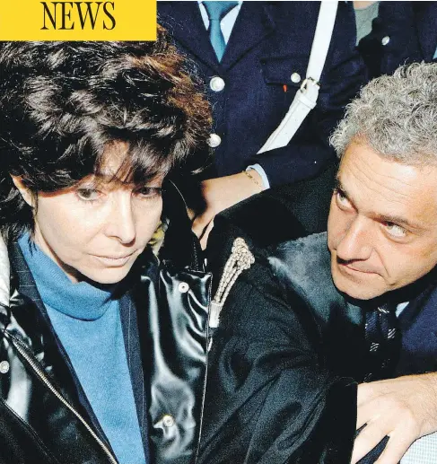  ?? AFP FILES ?? Patrizia Reggiani, ex-wife of slain Italian fashion mogul Maurizio Gucci, leaves court in November 1998 in Milan. The person at right is unidentifi­ed.
