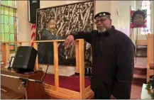  ?? MARTIN MCCONNELL — THE MORNING JOURNAL ?? Lorain artist Jeff Pye stands with a piece of his artwork at Wesley United Methodist Church, 220 W 7th St. in Lorain, on Martin Luther King Jr. Day, Jan. 15.