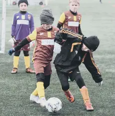  ??  ?? Durham United Wolves Under-7s (dark red) v Peterlee Helford (black/orange).