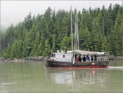  ?? ROBIN ROWLAND/ CP ?? The Suncrest, a 42- foot former commercial fi shing boat, passes the site of the proposed Enbridge Northern Gateway bitumen terminal on Douglas Channel, south of Kitimat. The majority of British Columbians oppose the project.