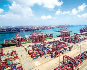  ?? STR/AFP ?? Containers are stacked at Qingdao port in Qingdao in China’s eastern Shandong province.