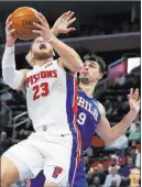  ?? Carlos Osorio ?? The Associated Press Pistons forward Blake Griffin goes up for a shot against 76ers forward Dario Saric on Tuesday in Detroit.
