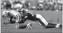  ?? NWA Democrat-Gazette file photo/MICHAEL WOODS ?? University of Arkansas defensive back Eddie Jackson puts the hit on LSU’s Jerel Myers in this photo from 2001.