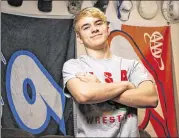  ?? THE DALLAS MORNING NEWS ?? Mack Beggs (at home last month), a transgende­r student at Euless Trinity High, won a state title wrestling against girls, as UIL rules require. Beggs, 17, says that if allowed, he’d compete against boys.
