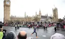  ?? ?? Mo Farah runs past the Houses of Parliament on his farewell London Marathon appearance. Photograph: Henry Nicholls/ Reuters