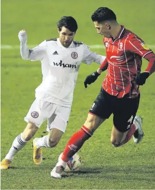  ?? Nigel French ?? ●● Stanley’s Paul Smyth takes on Lincoln City’s Lewis Montsma