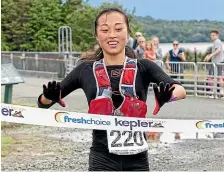  ?? BARRY HARCOURT ?? Nancy Jiang, who lives in Queenstown, wins the women’s 2018 Kepler Challenge at Te Anau on Saturday.