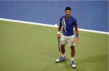  ?? Frank Franklin / Associated Press ?? Novak Djokovic beat Damir Dzumhur 6-1, 6-4, 6-1 on Monday in the first round of the U.S. Open. Djokovic is the No. 1 seed in the tournament and worldwide and entered as the clear favorite in men’s singles.