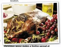  ??  ?? Christmas goose makes a festive spread at German restaurant Zum Schneider.