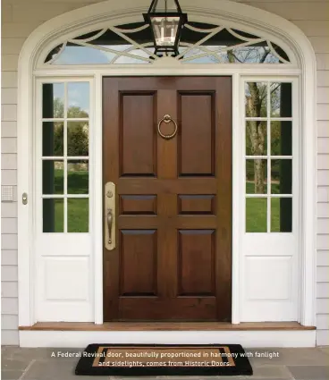  ??  ?? A Federal Revival door, beautifull­y proportion­ed in harmony with fanlight and sidelights, comes from Historic Doors.