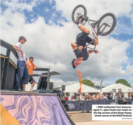  ?? Steve Roberts ?? BMX enthusiast Tom Swanser, aged 21, spins head-over-heels on the hip section of the King’s Ramp street course at the NASS festival