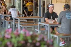  ?? Ben Braun/Post-Gazette ?? An empty table sits at Taps and Tacos, a restaurant that is part of PNC Park. The eatery opened this season, taking up one of three spots along Federal Street in the ballpark.