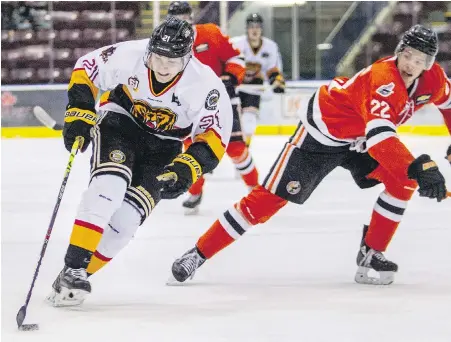  ?? DARREN STONE, TIMES COLONIST ?? Grizzlies forward Connor Eddy wheels around Clippers defenceman Skyler Cameron at The Q Centre on Thursday.