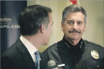  ?? Al Seib Los Angeles Times ?? LAPD CHIEF Charlie Beck, shown with the mayor in January, got a temporary restrainin­g order against Sheila Hines-Brim, who threw what she said were ashes of her niece at him at a Police Commission meeting.