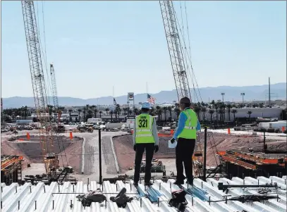  ?? Erik Verduzco ?? Las Vegas Review-journal @Erik_verduzco3 Don Webb, left, chief operating officer of the LV Stadium Co., gives a tour of the Raiders stadium constructi­on site to Reviewjour­nal reporter Richard N. Velotta on Nov. 12. Webb said the team is “preserving our option” to choose an energy provider.