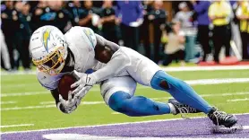 ?? Abbie Parr/Associated Press ?? Chargers linebacker Kenneth Murray Jr. seals Los Angeles’ win after intercepti­ng Vikings quarterbac­k Kirk Cousins in the end zone with seven seconds left Sunday.