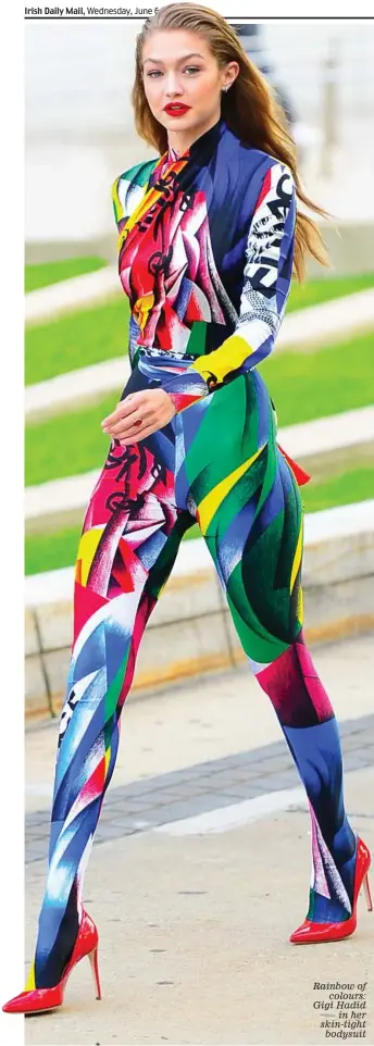  ??  ?? Rainbow of colours: Gigi Hadid in her skin-tight bodysuit