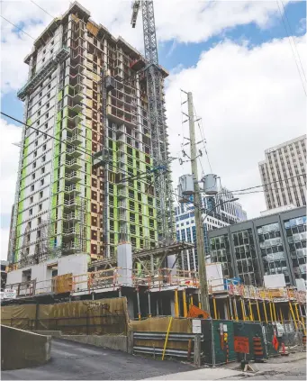 ?? ERROL MCGIHON ?? The Ministry of Labour is investigat­ing after one person fell in an elevator shaft at a downtown constructi­on site on Nepean Street Wednesday morning. The location is a Claridge Homes project.