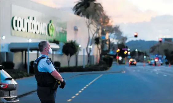  ?? Photo / Getty Images ?? Police guard the area around Auckland’s Countdown LynnMall after Friday’s terror incident.